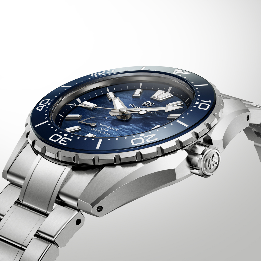 Side perspective highlighting the polished bezel and the slim stainless steel case.
