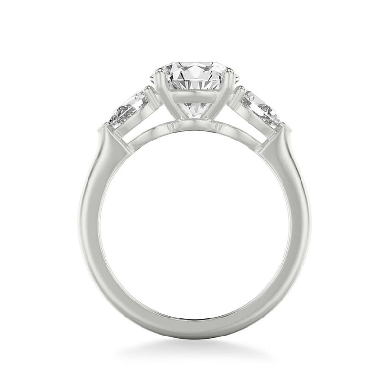 Side View Of Round Three-Stone Engagement Ring with 1/2 CTW Pear Sides.