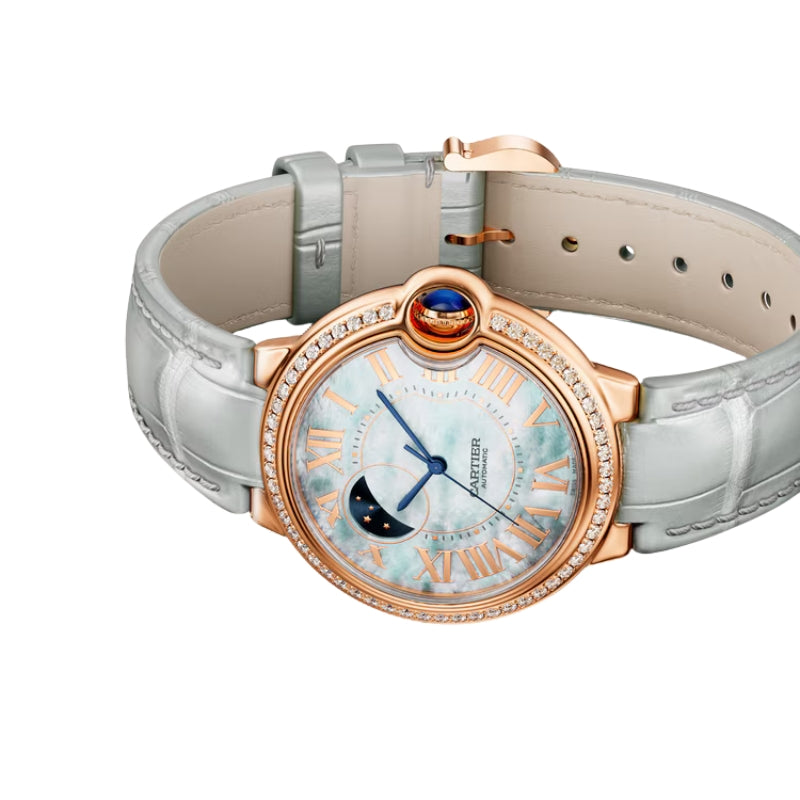 Angled view of luxury watch with grey leather.