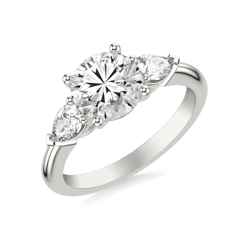 Tilted View Of Round Three-Stone Engagement Ring with 1/2 CTW Pear Sides.
