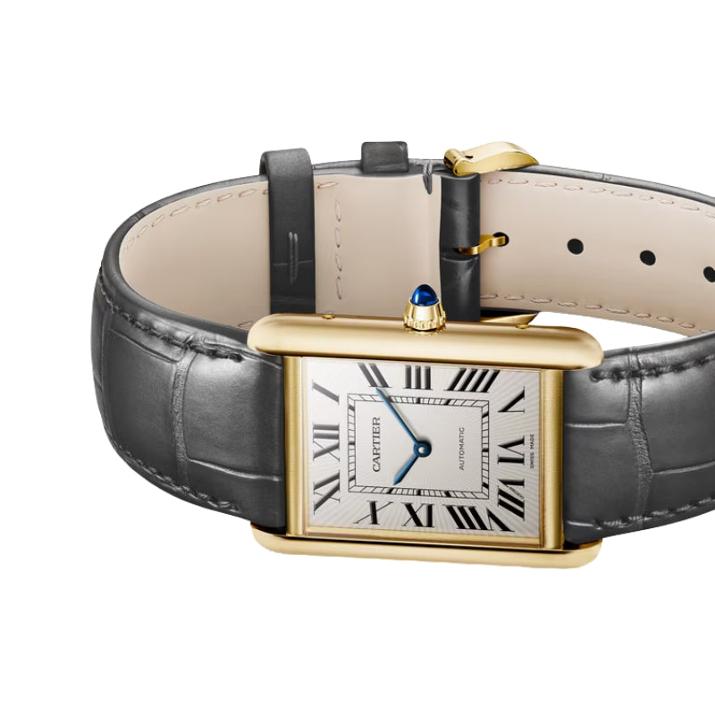 Angled view of gold Cartier Tank watch.