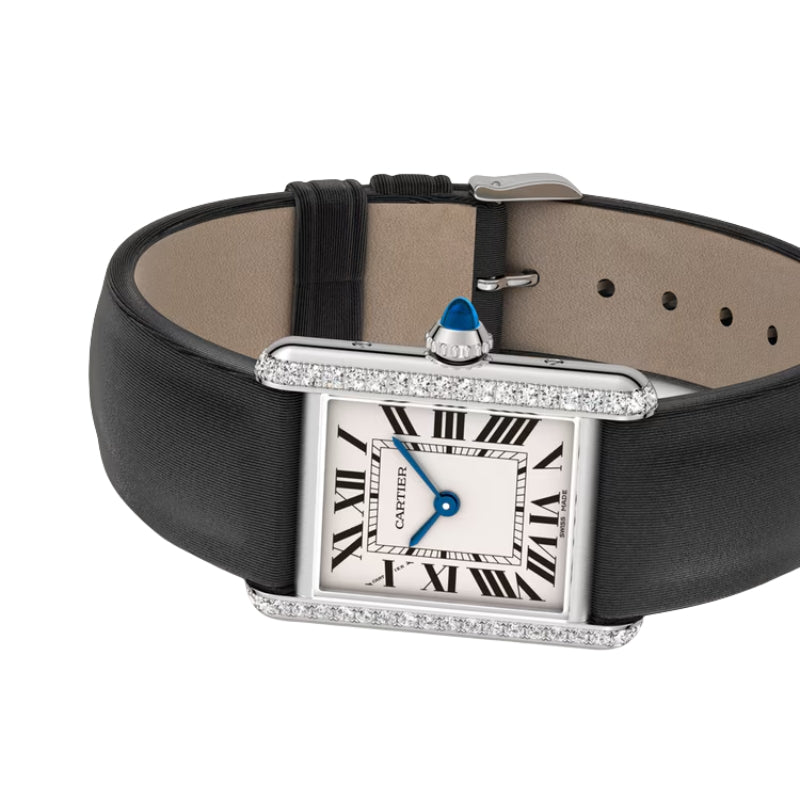 Angled view of Cartier watch with silk strap.