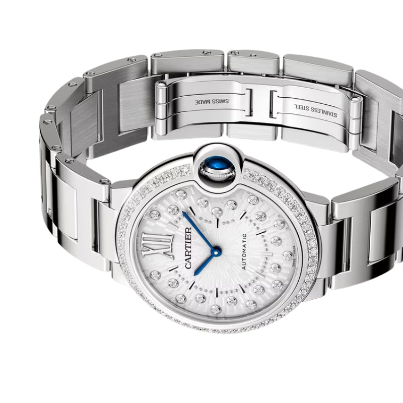 Angled view of silver watch with open clasp.