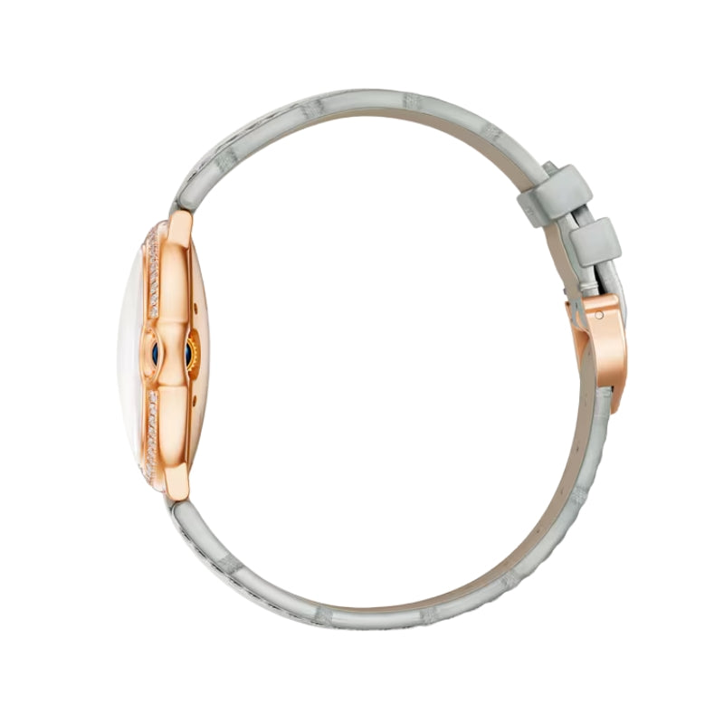 Side profile of rose gold watch and strap.