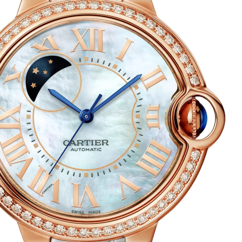 Close up of moon phase watch face dial.