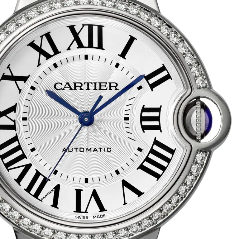 Close-up of watch face with diamonds and numerals.