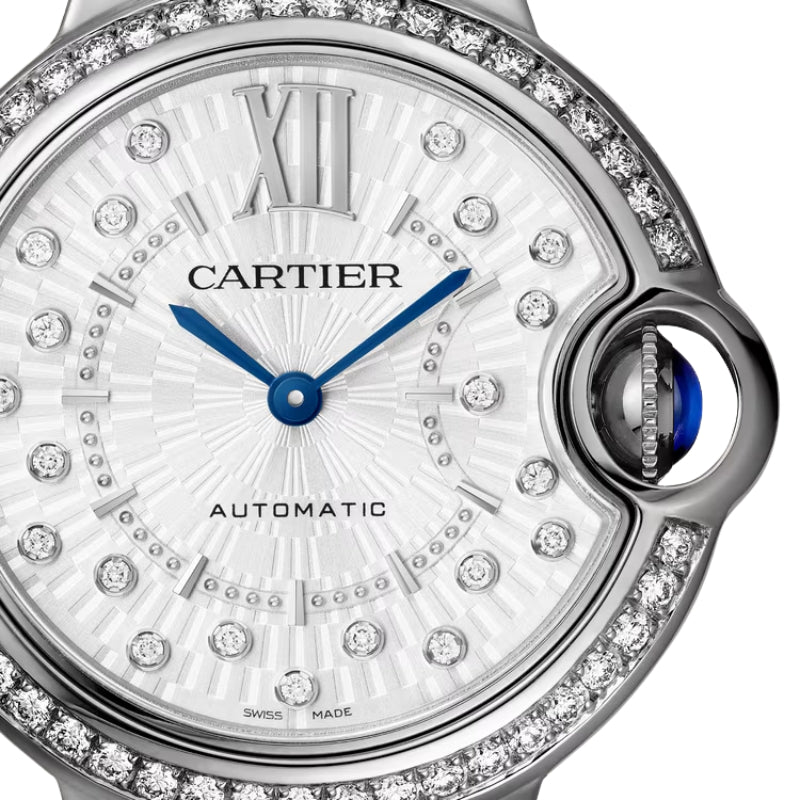 Close up of Cartier watch face with diamonds.