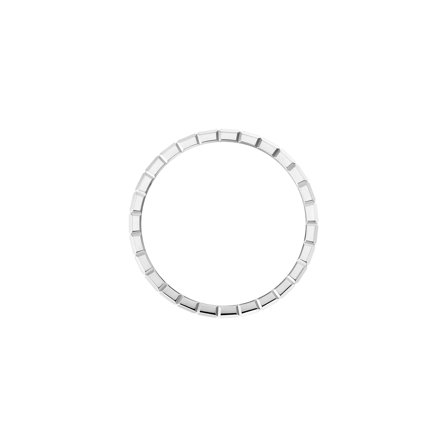 Overhead shot of a circular white gold ring with geometric texture.