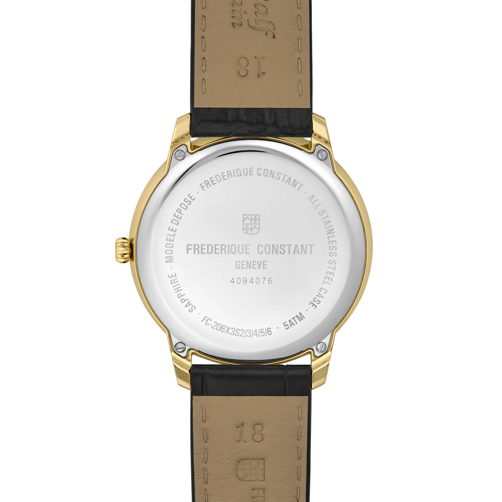 View of the polished gold-toned caseback and the tan leather lining of the black strap.