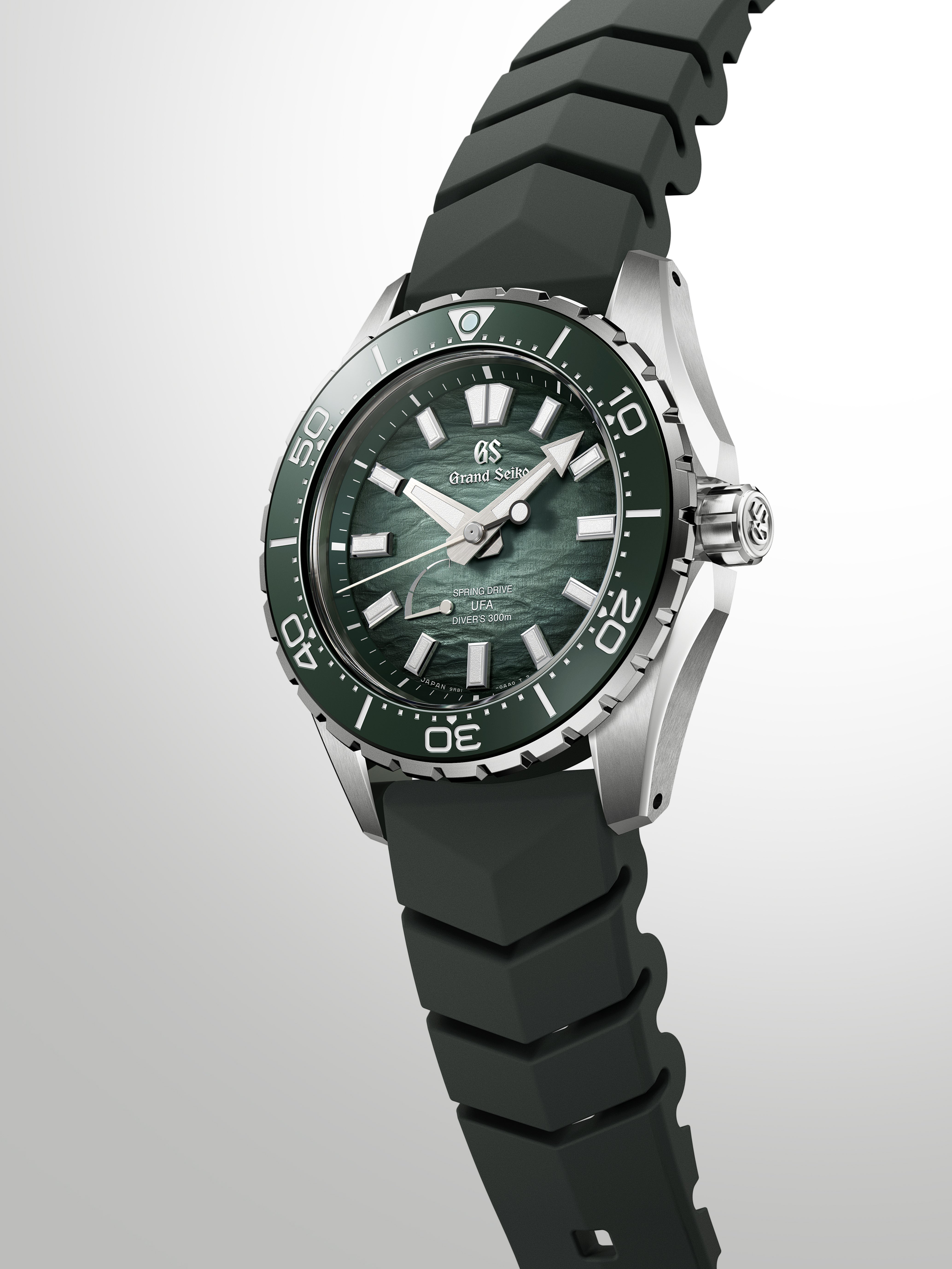 Minimalist aesthetic view of the watch resting against a clean, dark backdrop.