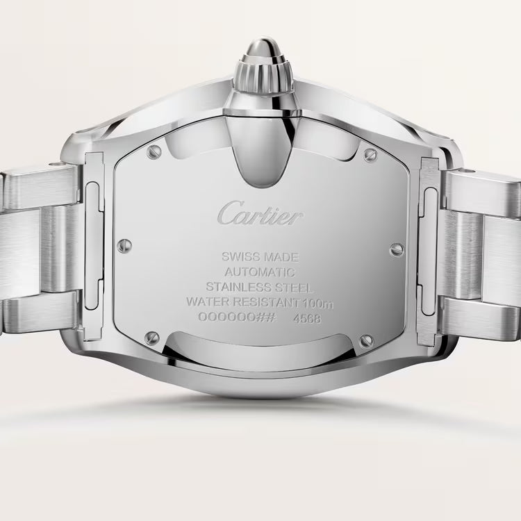 Detailed view of engraved case back with official Cartier brand signatures.