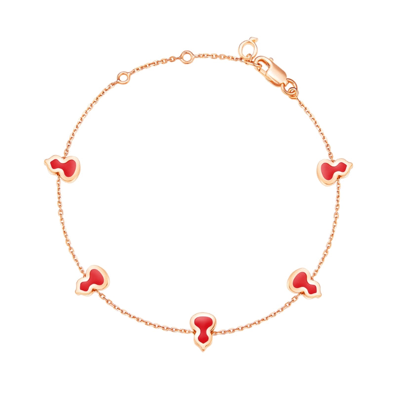 Full VIew Of Qeelin Wulu mini bracelet in 18K rose gold and red enamel.