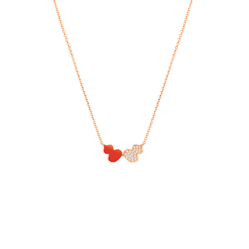Close Up View Qeelin Wulu Echo necklace in 18K rose gold and red with diamonds.