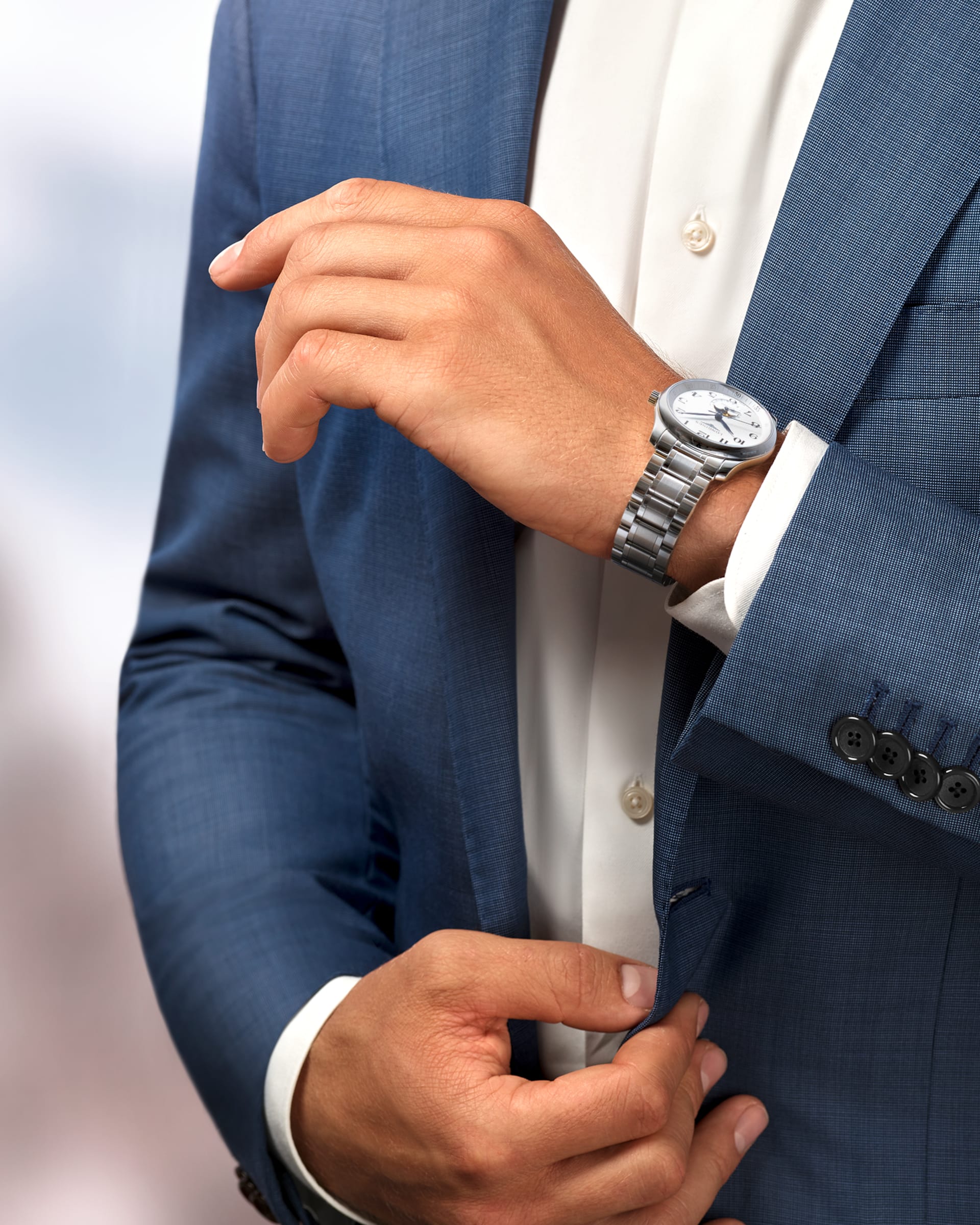 Man in suit wearing Master Collection 40mm Stainless Steel with Moon Phase