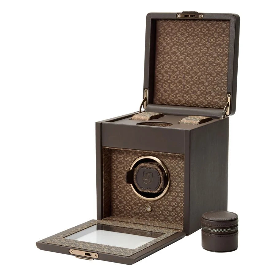 Open view of a watch winder box with an accessory pouch.