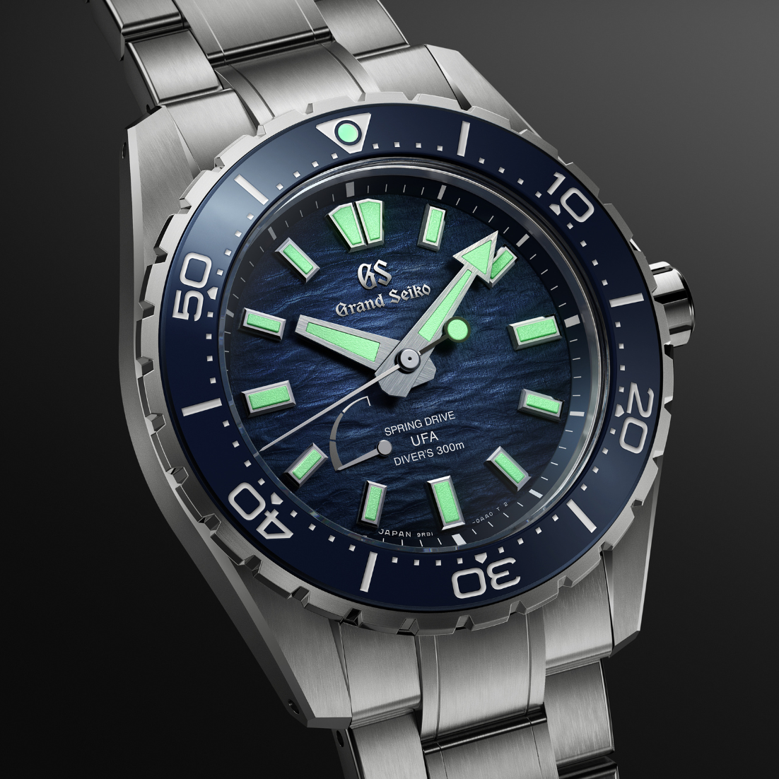 An angled studio shot focusing on the integrated steel bracelet and watch lugs.