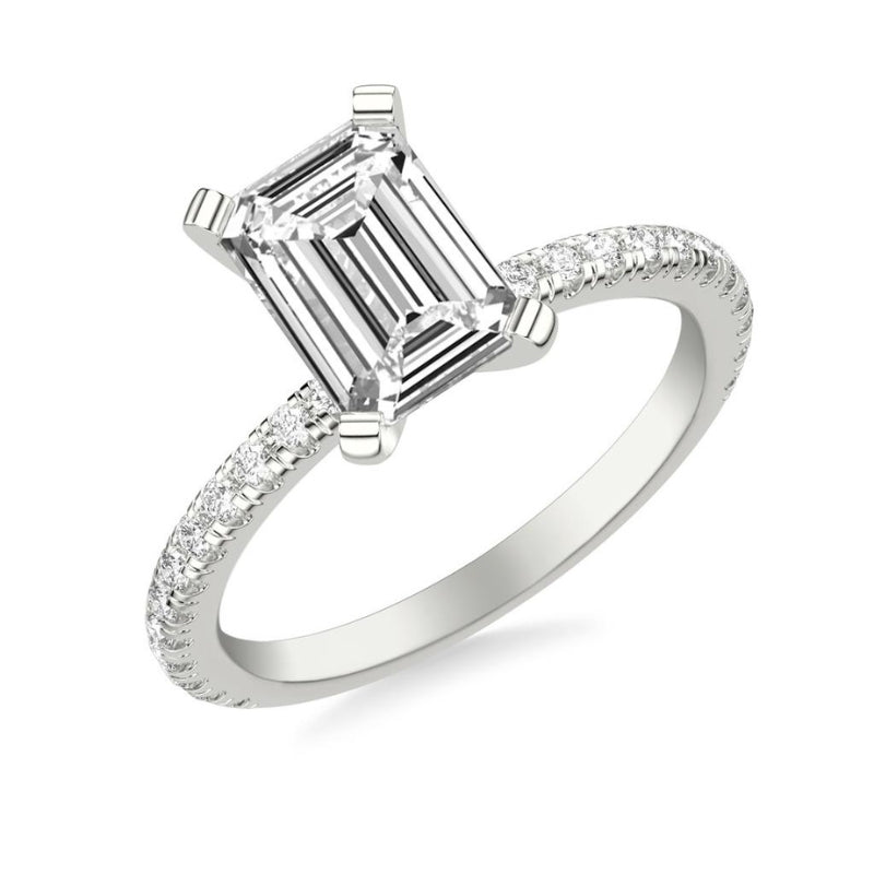 Tilted View Of Emerald Classic Engagement Ring with Diamonds.