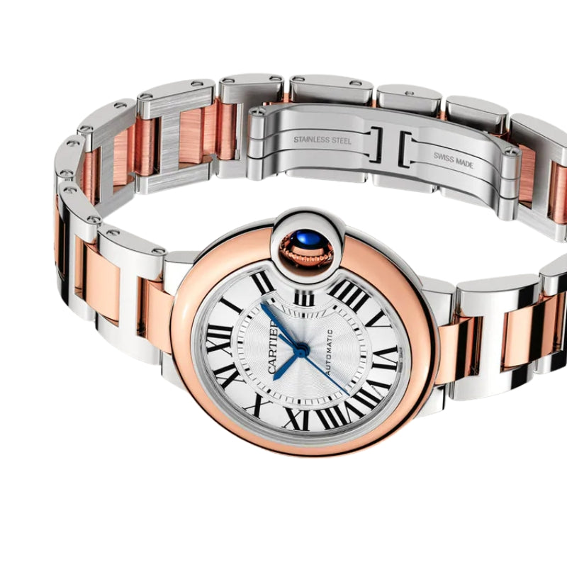Angled view of two-tone watch with open clasp.