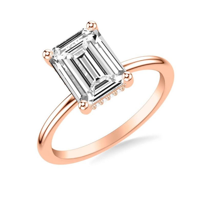 Tilted View Of Emerald Engagement Ring with Hidden Halo.