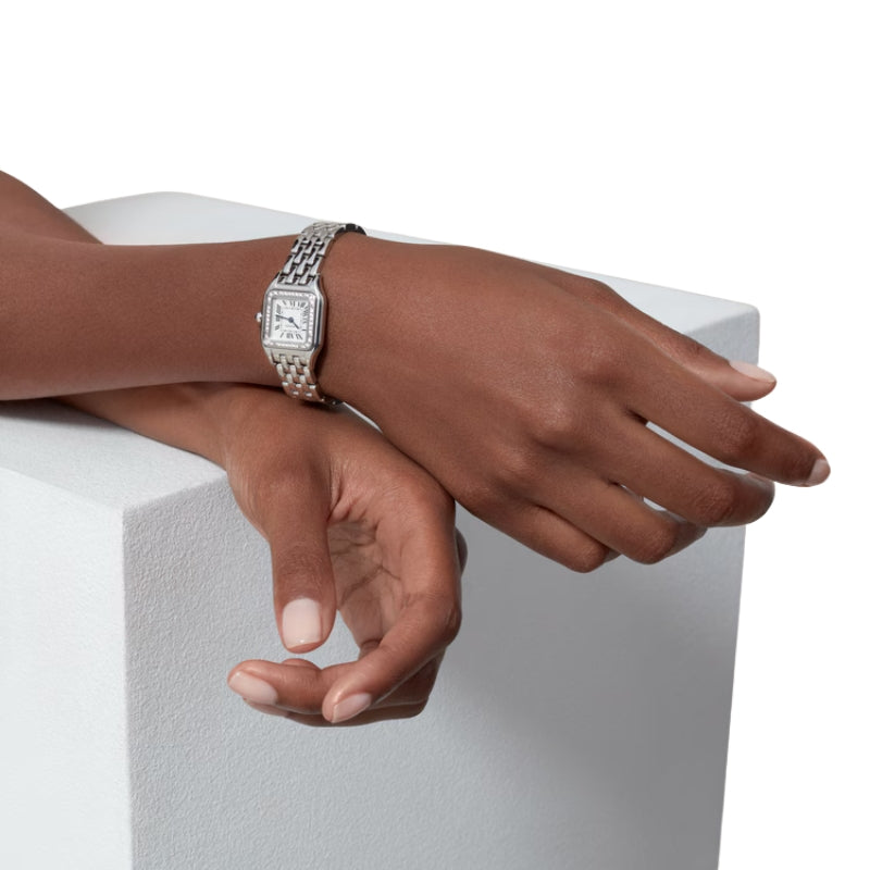 Panthère de Cartier watch worn on female wrist.