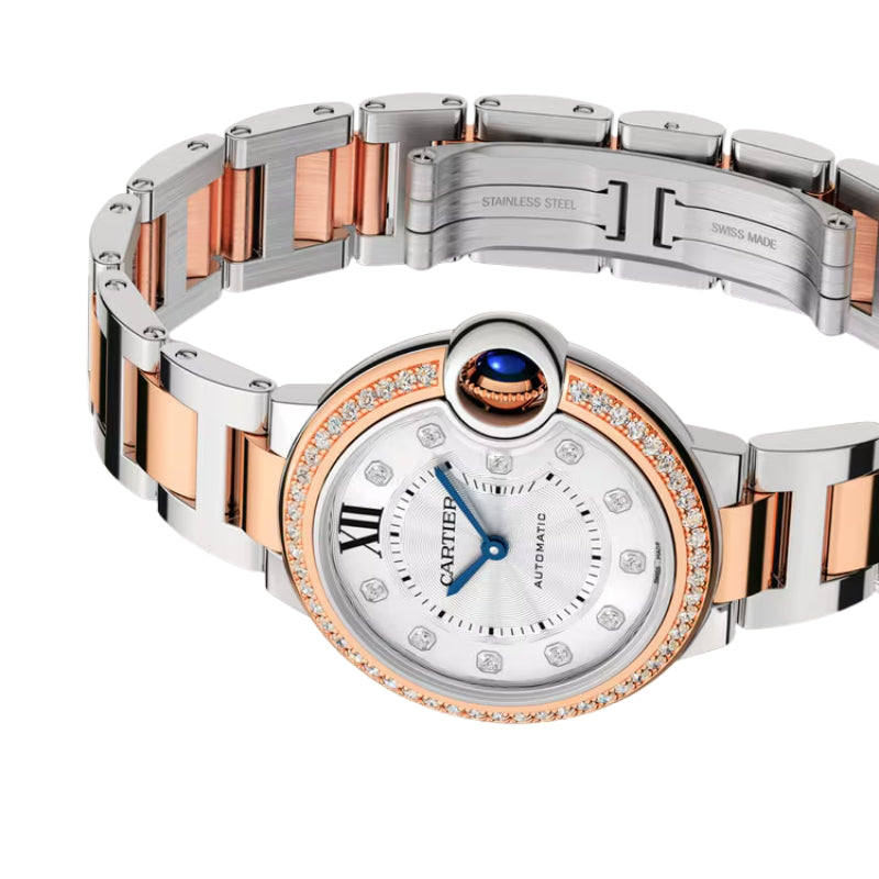 Two-tone luxury watch showing open clasp and bracelet.