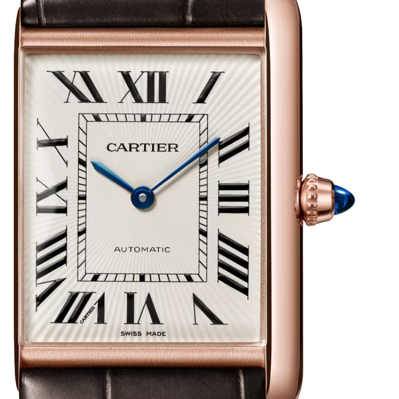 Close-up detail of rose gold Cartier watch dial.