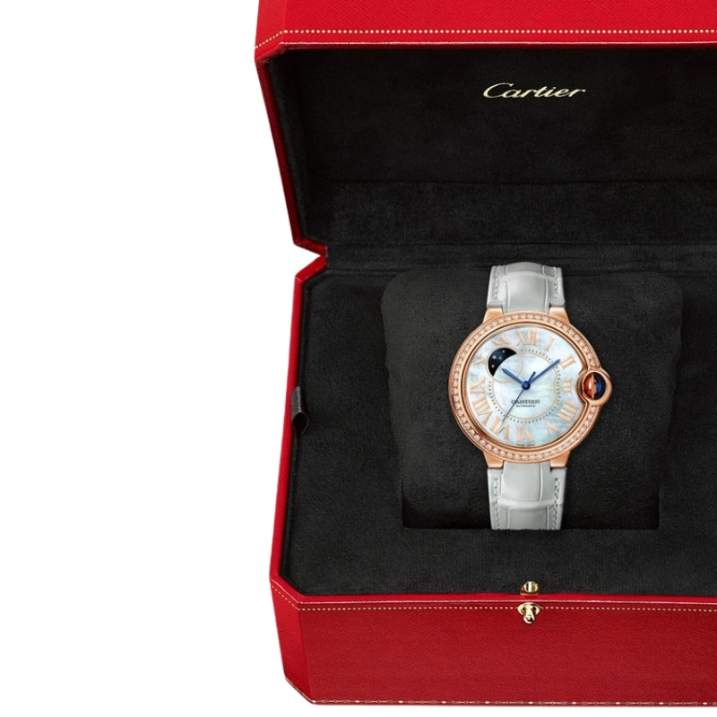 Cartier watch in red box with grey strap.