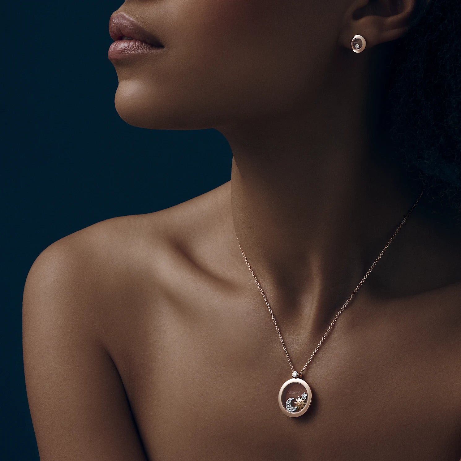 Lifestyle image of Chopard Happy Diamonds Rose Gold Pendant Happy Sun, Moon and Stars 799434-5201