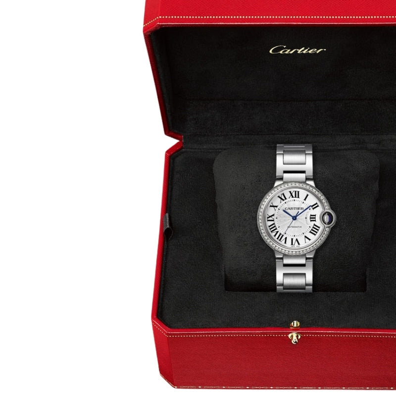 Silver luxury watch displayed in a red box.