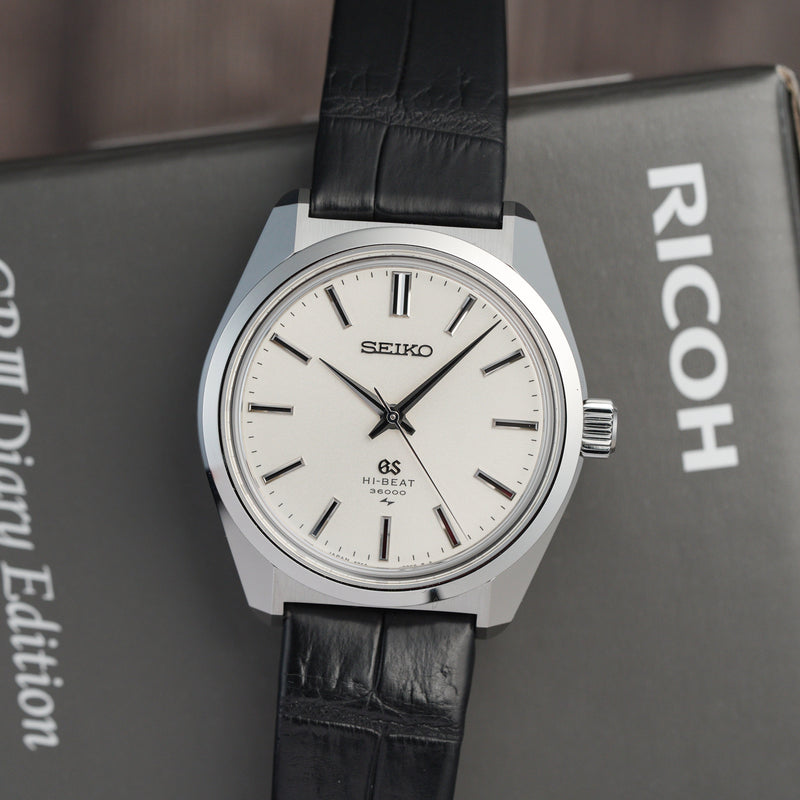 Grand Seiko SLGW005 45GS Recreation Limited Edition flatlay lifestyle shot