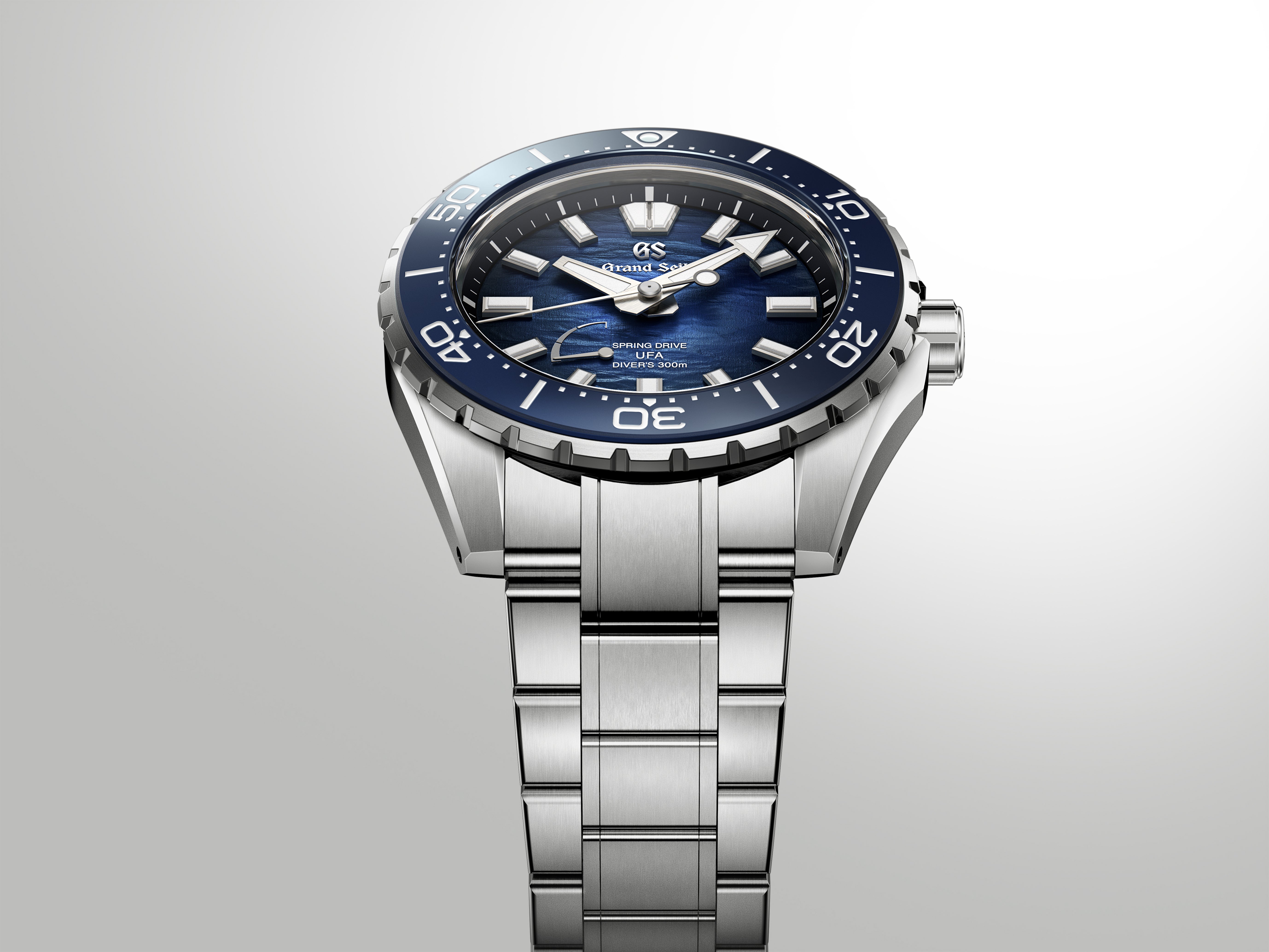 An angled studio shot focusing on the integrated steel bracelet and watch lugs.