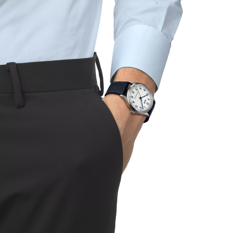 Man wearing TISSOT HERITAGE 1938 AUTOMATIC COSC 39MM Silver dial leather strap