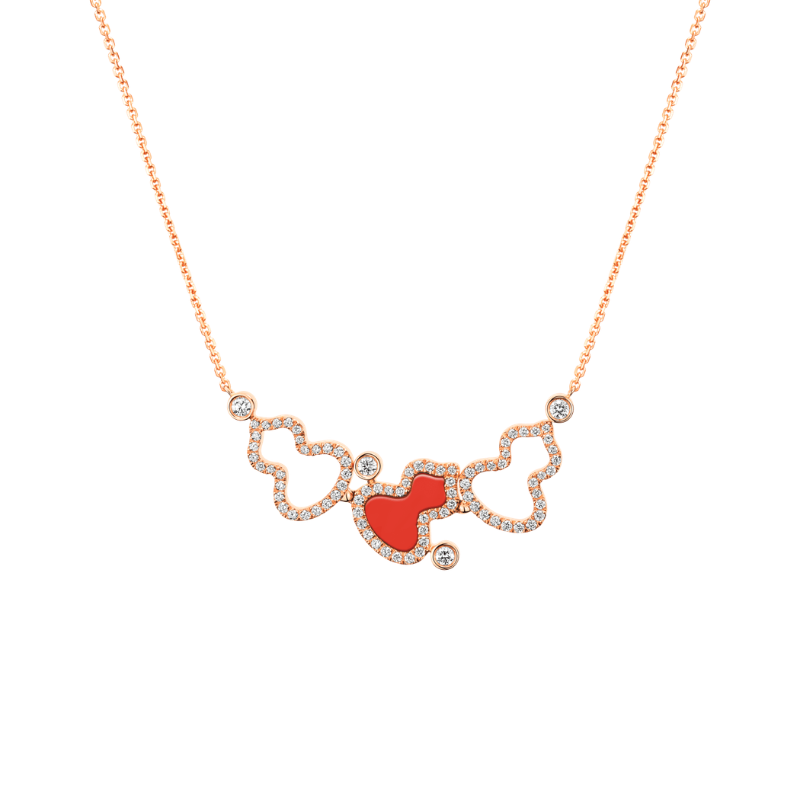 Close Up View Qeelin Wulu small necklace in 18K rose gold set with red and diamonds.