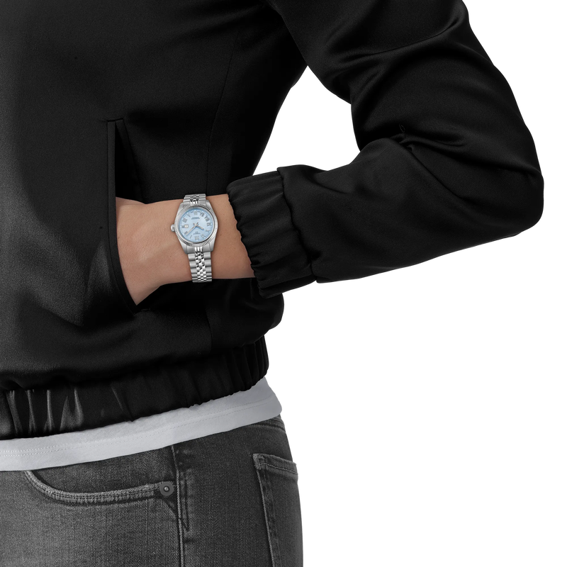 Person wearing Tissot Ballade Ladies 30mm Blue Dial watch