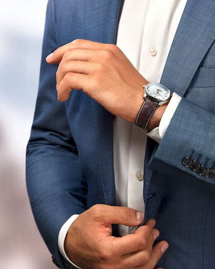 Man in Suit wearing Master Collection 40mm Stainless Steel Diamond Dial on Brown Alligator Leather Strap with Moon Phase