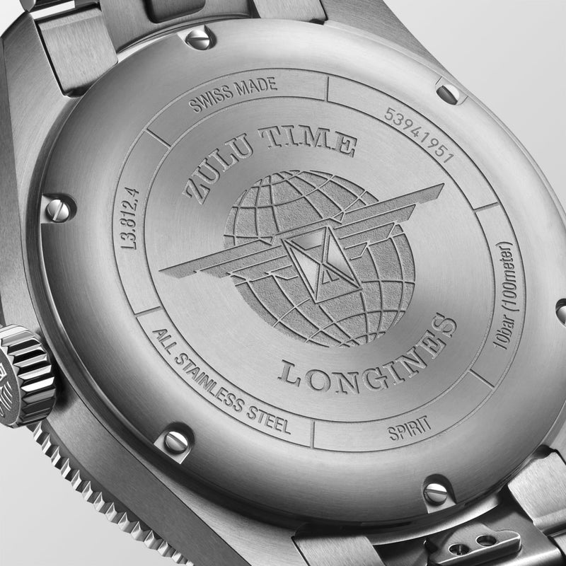 Close-up of a Longines watch caseback with engraved text and logo.