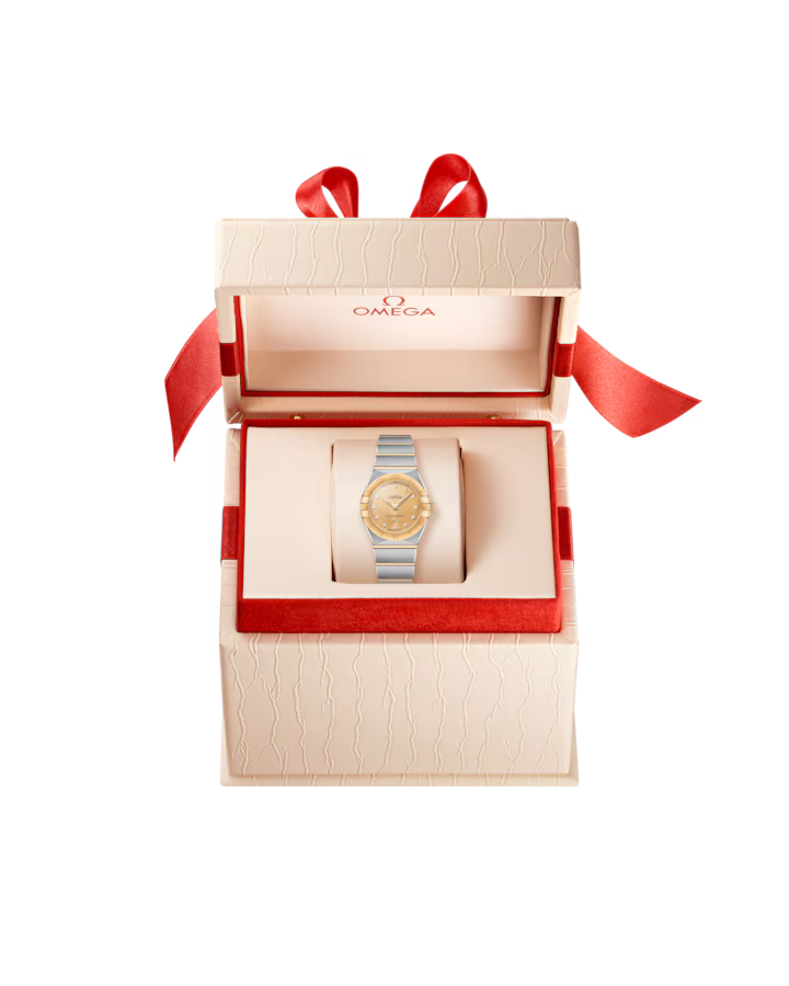 Luxury watch displayed inside premium cream gift box.