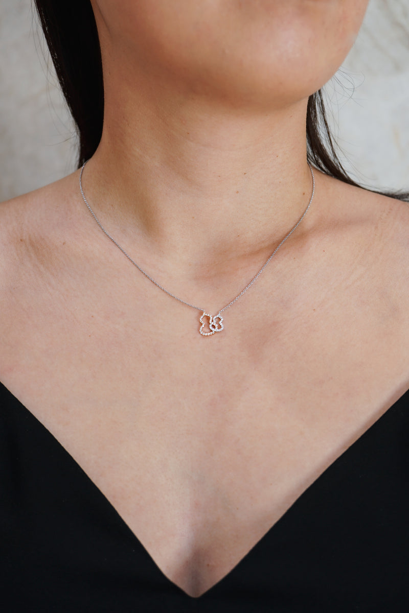 Qeelin Petite Wulu necklace in 18K white gold and rose gold with diamonds