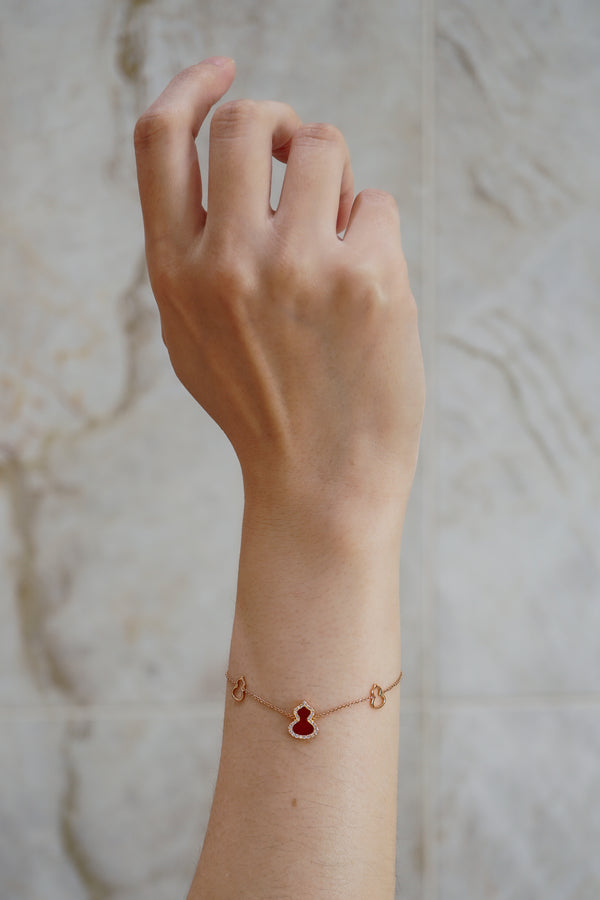 Qeelin Wulu bracelet in 18K rose gold with diamonds and red agate